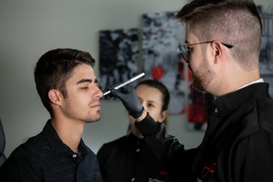 Surgeon marking patient's face for medical procedure in clinic setting.
