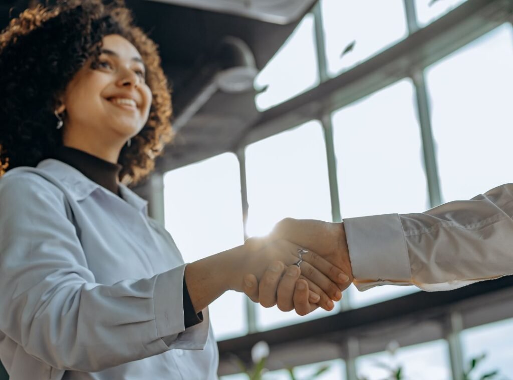 women shaking hands